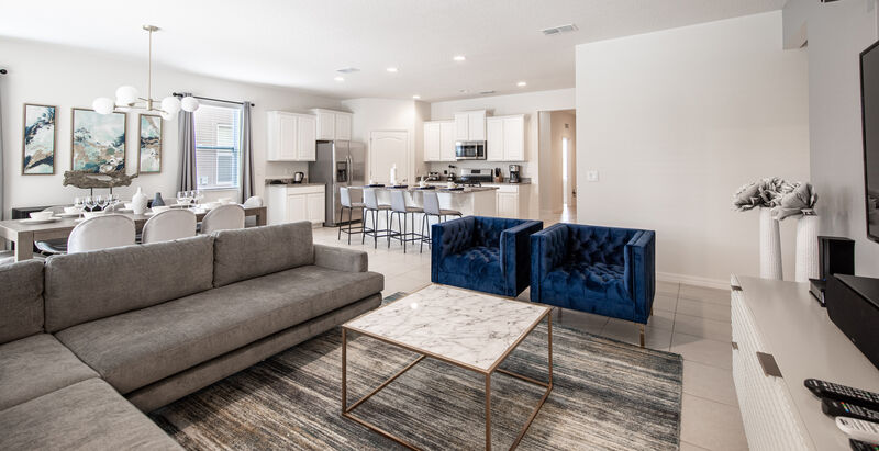 living area with couch and chairs